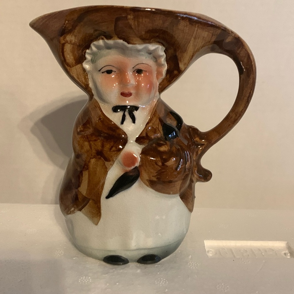TOBY, creamer/pitcher. ENGLAND, woman with umbrella , vintage